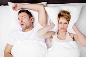 Man Snoring Wife Covering