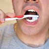 Man Brushing his Teeth