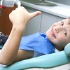 Boy Smiling in Dental Chair