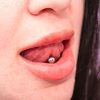 Girl with Pierced Tongue
