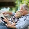 Grandfather Reading To Child