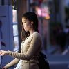 Woman Using Vending Machine