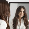 Woman Looking Into Mirror