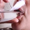 Man Drinking a Glass of Water