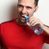 Man Opens Bottle Water with Teeth